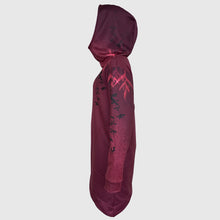 Ielādēt video galerijas pārlūkā, Women's A-line running skirt with an ombre (burgundy and pink) base and a Strelitzia floral pattern. The skirt has built-in black mid-length shorts with side pockets and a zipper pocket on the back.