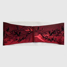 Ielādēt video galerijas pārlūkā, Women's A-line running skirt with an ombre (burgundy and pink) base and a Strelitzia floral pattern. The skirt has built-in black mid-length shorts with side pockets and a zipper pocket on the back.
