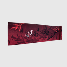 Ielādēt video galerijas pārlūkā, Women's A-line running skirt with an ombre (burgundy and pink) base and a Strelitzia floral pattern. The skirt has built-in black mid-length shorts with side pockets and a zipper pocket on the back.