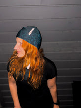 Ielādēt video galerijas pārlūkā, Women's A-line running skirt with an ombre (burgundy and pink) base and a Strelitzia floral pattern. The skirt has built-in black mid-length shorts with side pockets and a zipper pocket on the back.