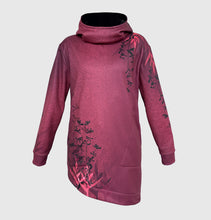 Ielādēt video galerijas pārlūkā, Women's A-line running skirt with an ombre (burgundy and pink) base and a Strelitzia floral pattern. The skirt has built-in black mid-length shorts with side pockets and a zipper pocket on the back.