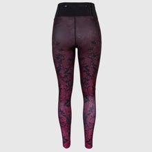 Ielādēt video galerijas pārlūkā, Women's A-line running skirt with an ombre (burgundy and pink) base and a Strelitzia floral pattern. The skirt has built-in black mid-length shorts with side pockets and a zipper pocket on the back.