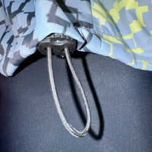 Ielādēt video galerijas pārlūkā, Women's A-line running skirt with an ombre (burgundy and pink) base and a Strelitzia floral pattern. The skirt has built-in black mid-length shorts with side pockets and a zipper pocket on the back.