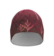 Ielādēt video galerijas pārlūkā, Women's A-line running skirt with an ombre (burgundy and pink) base and a Strelitzia floral pattern. The skirt has built-in black mid-length shorts with side pockets and a zipper pocket on the back.