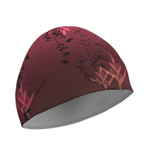 Ielādēt video galerijas pārlūkā, Women's A-line running skirt with an ombre (burgundy and pink) base and a Strelitzia floral pattern. The skirt has built-in black mid-length shorts with side pockets and a zipper pocket on the back.