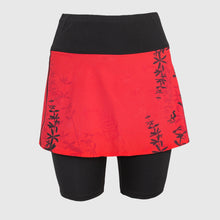 Ielādēt video galerijas pārlūkā, Women's A-line running skirt with an ombre (burgundy and pink) base and a Strelitzia floral pattern. The skirt has built-in black mid-length shorts with side pockets and a zipper pocket on the back.